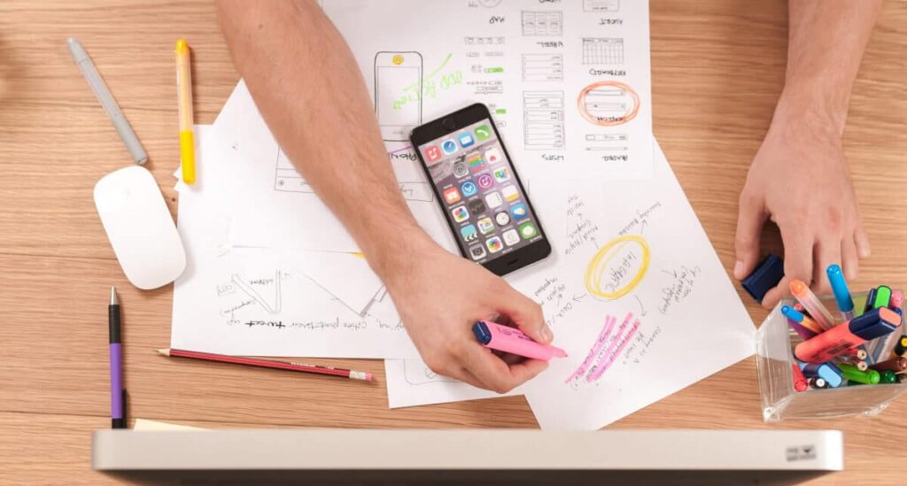 smart goals template and worksheet - person writing on a paper